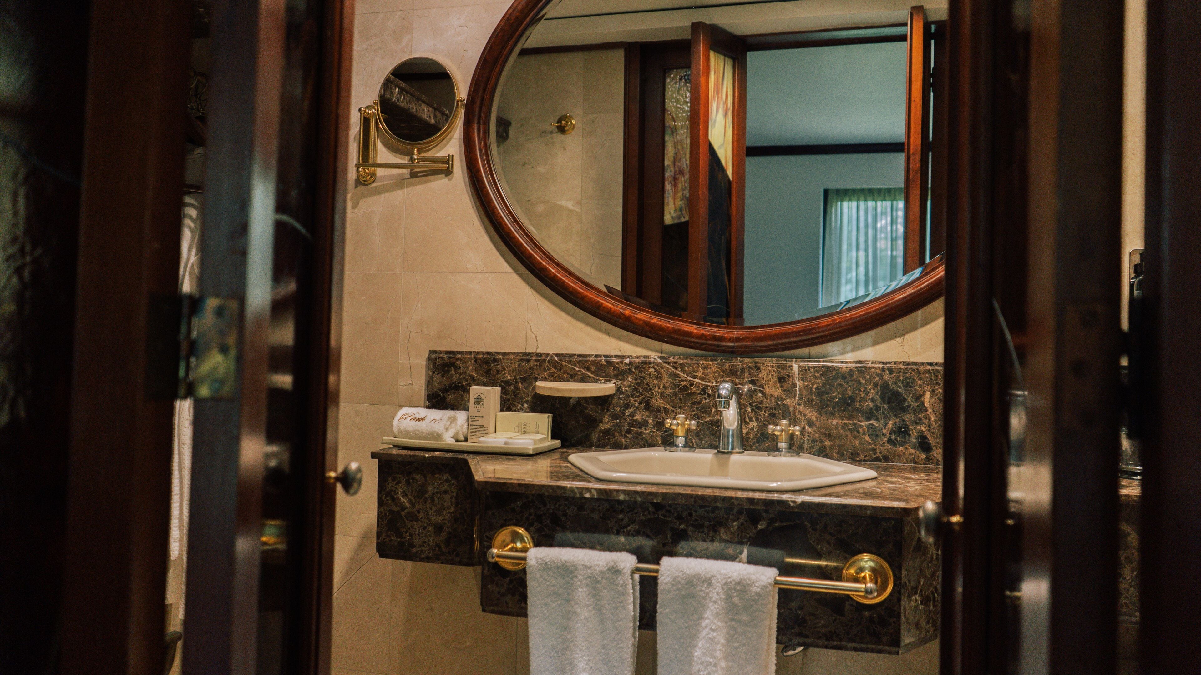 classic studio suite | bathroom | designer toiletries, hair dryer, bathrobes, slippers
