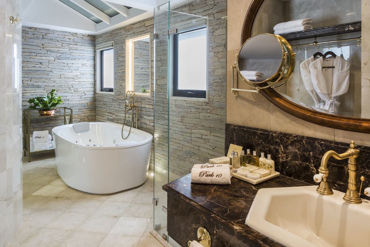 presidential suite | bathroom | designer toiletries, hair dryer, bathrobes, slippers