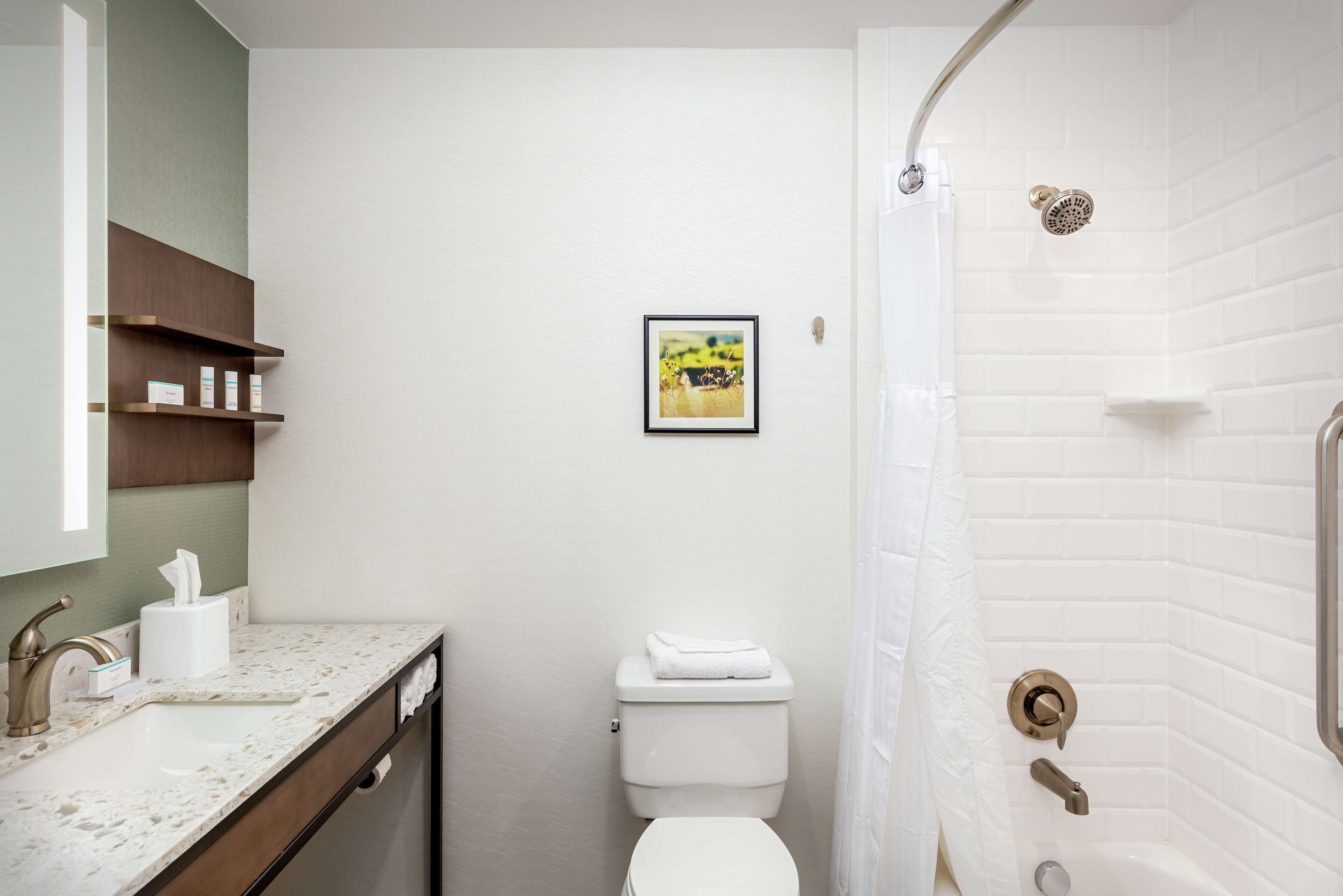 designer toiletries, hair dryer, towels, soap