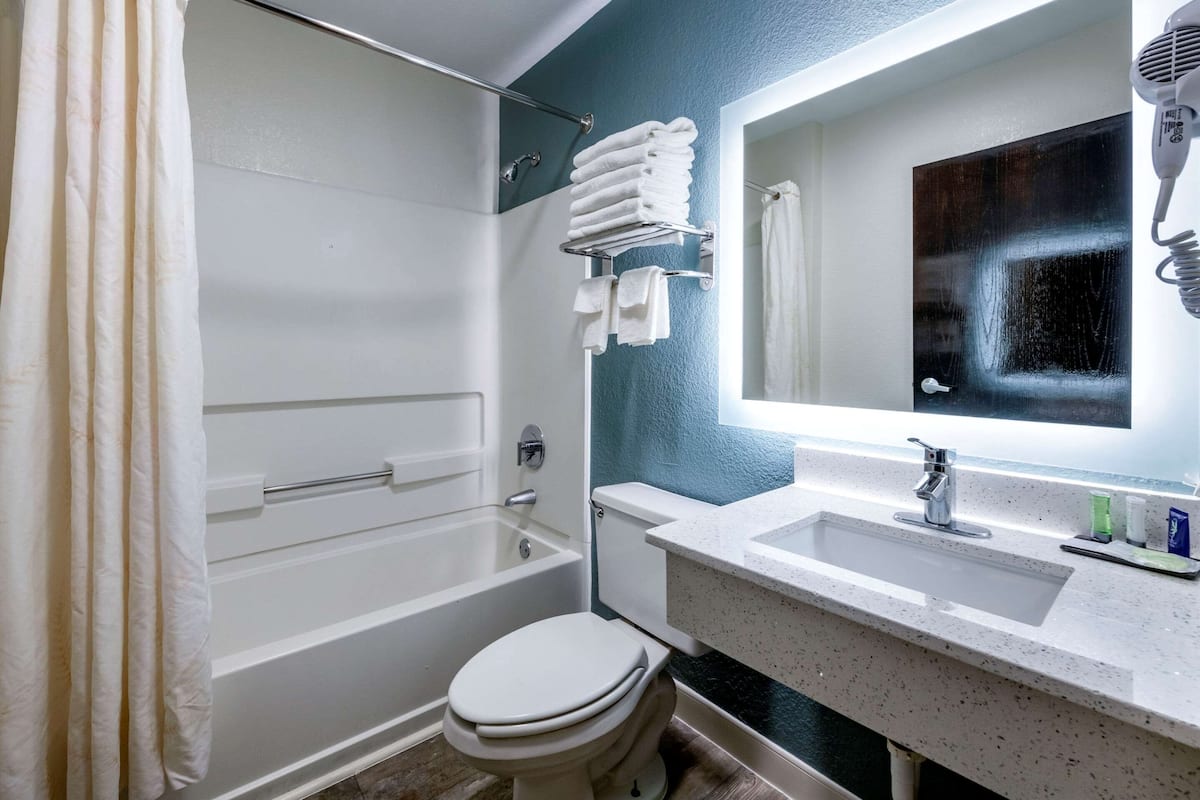 desk, blackout curtains, iron/ironing board, cots/infant beds