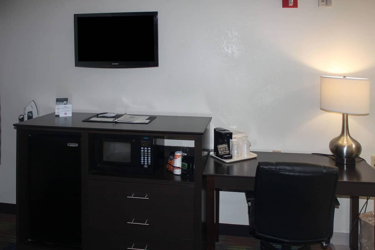 Desk, laptop workspace, blackout curtains, iron/ironing board