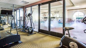 A gym with cardio equipment, weight machines, and a mirrored wall. - Quality Inn Columbia I-65 (Columbia)