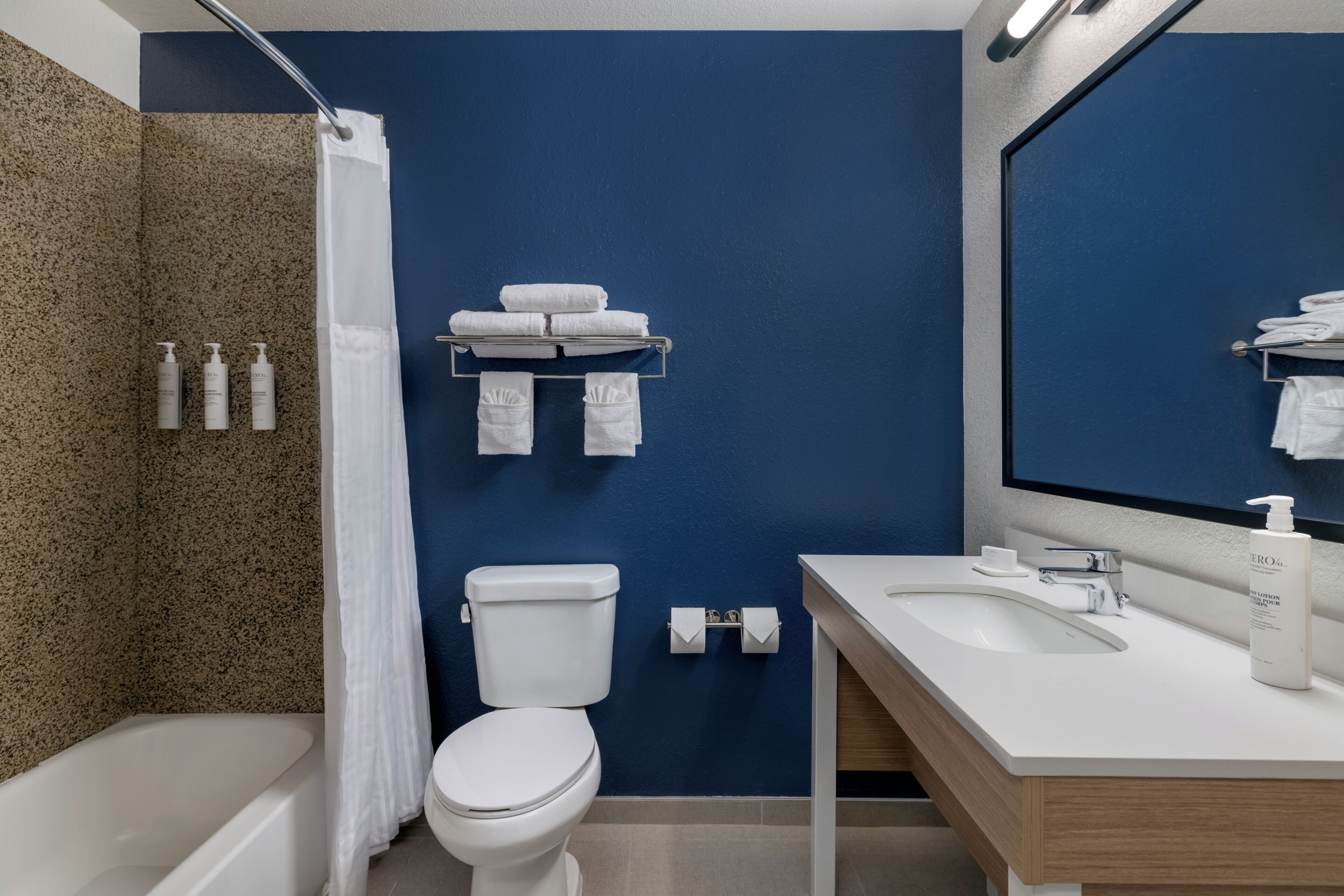 Combined shower/tub, hair dryer, towels, soap