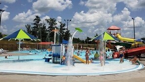 A water park with multiple slides and a pool area. - Comfort Inn St. Robert / Fort Leonard Wood (St. Robert)