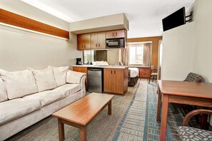 Desk, laptop workspace, blackout drapes, iron/ironing board