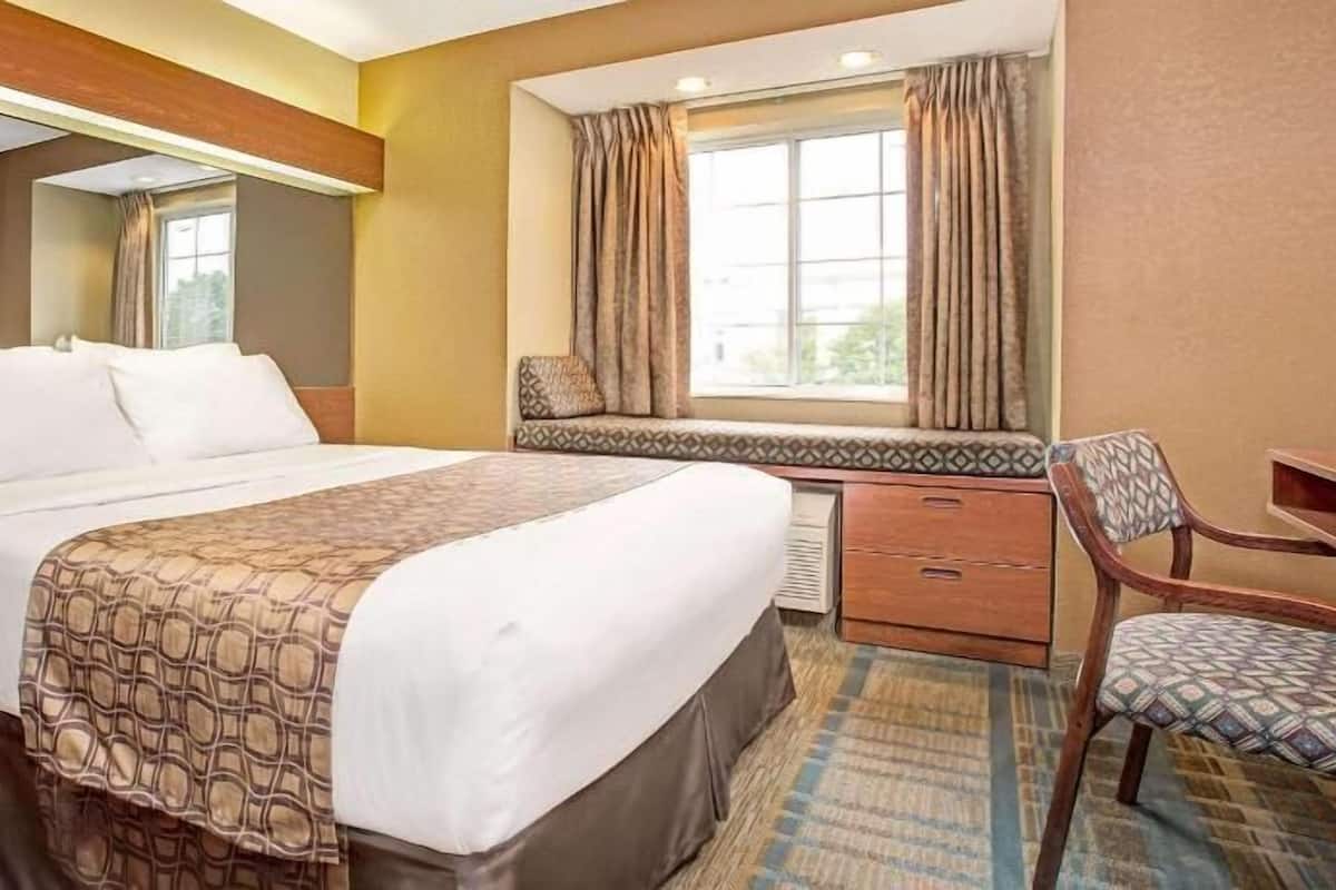 Desk, laptop workspace, blackout curtains, iron/ironing board