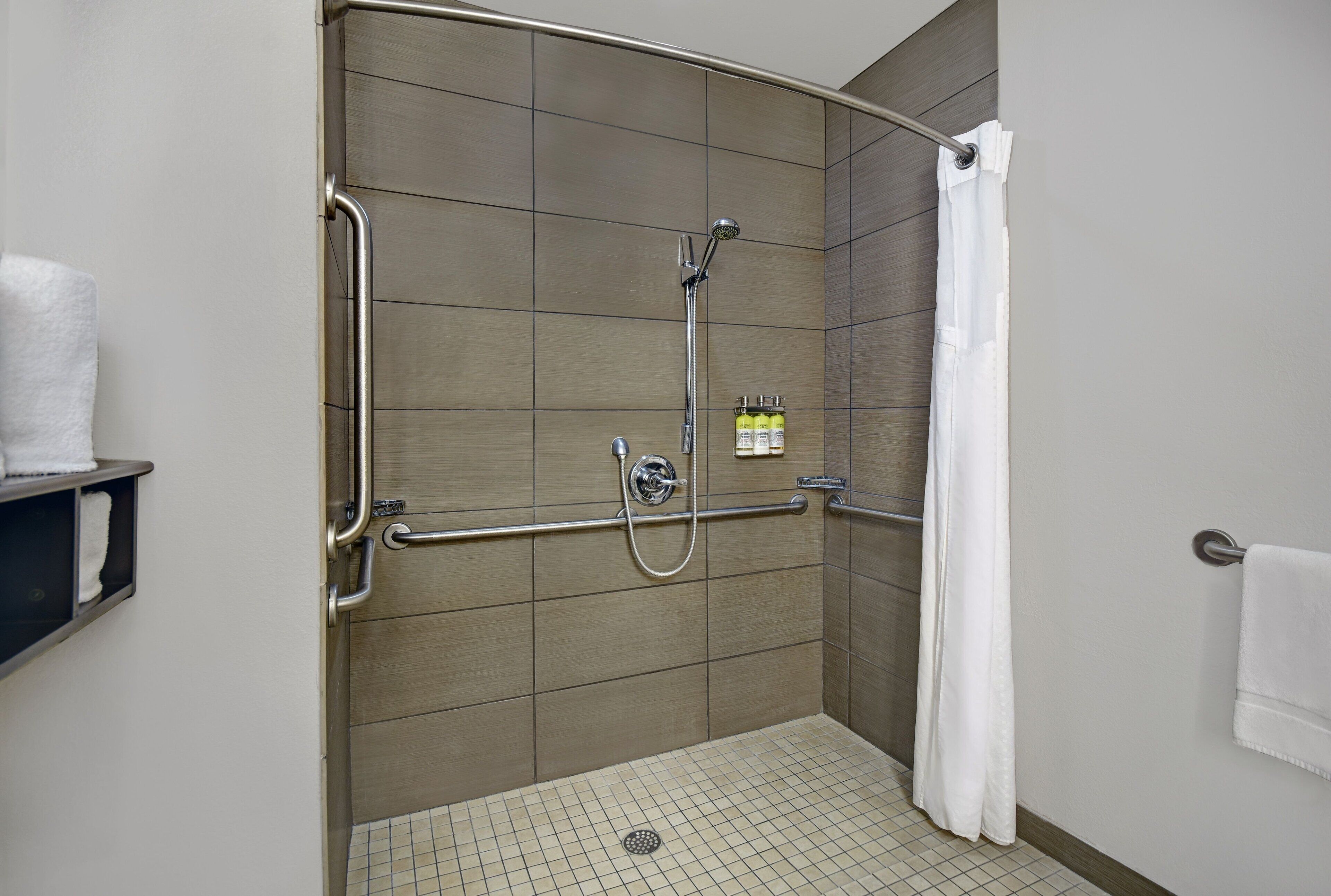 suite, 1 king bed, accessible (communication, roll-in shower) | bathroom | combined shower/bathtub, designer toiletries, hair dryer, towels