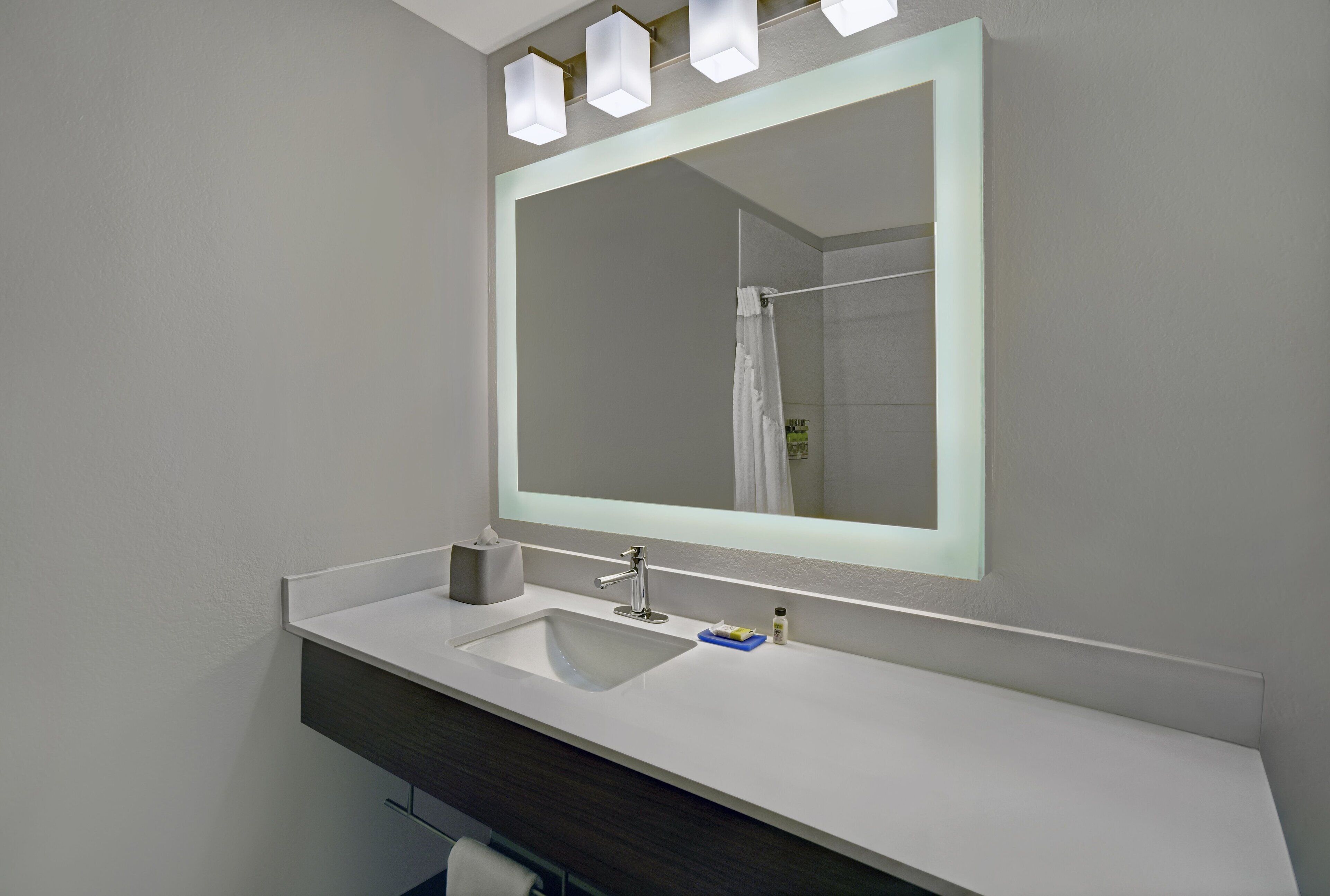 combined shower/bathtub, designer toiletries, hair dryer, towels