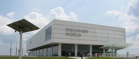 A modern building with the sign "Discovery World" on the facade.