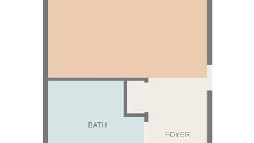 Un plano de planta que muestra un dormitorio, baño y vestíbulo.