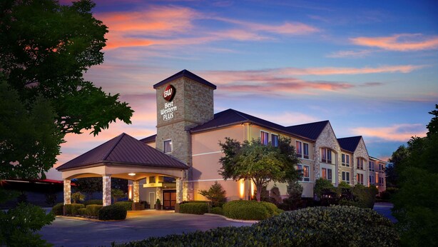 A hotel with a prominent tower labeled "Best Western Plus," a covered entrance, and well-maintained landscaping. - Best Western Plus Lewisville Flower Mound (Lewisville)