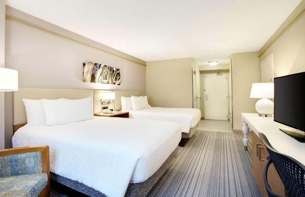 Premium bedding, desk, laptop workspace, blackout curtains