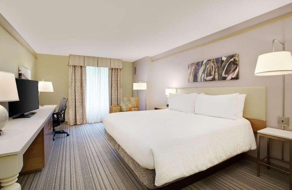 Premium bedding, desk, laptop workspace, blackout curtains