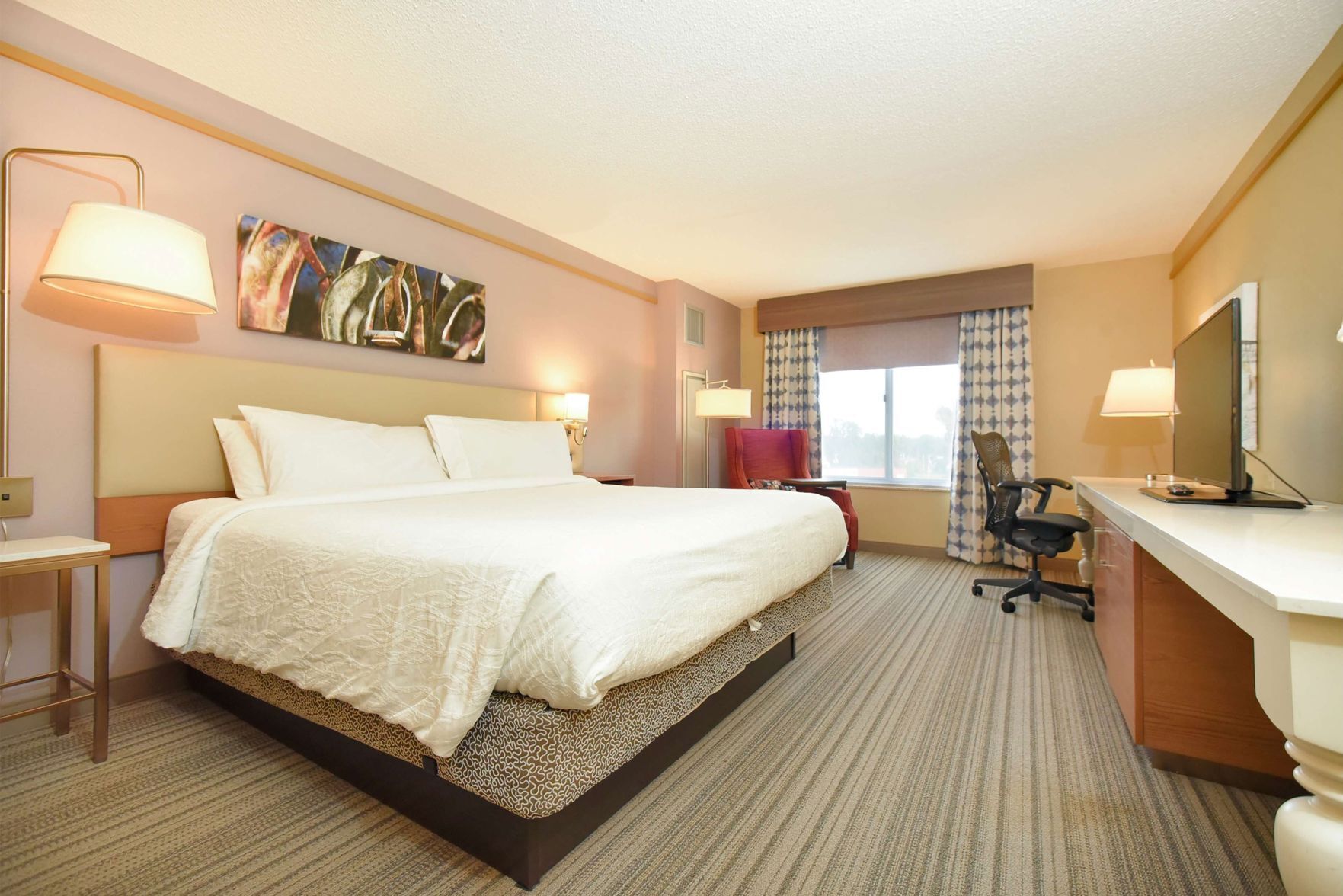 Premium bedding, desk, laptop workspace, blackout curtains