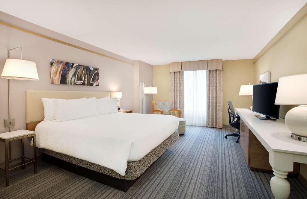 Premium bedding, desk, laptop workspace, blackout curtains