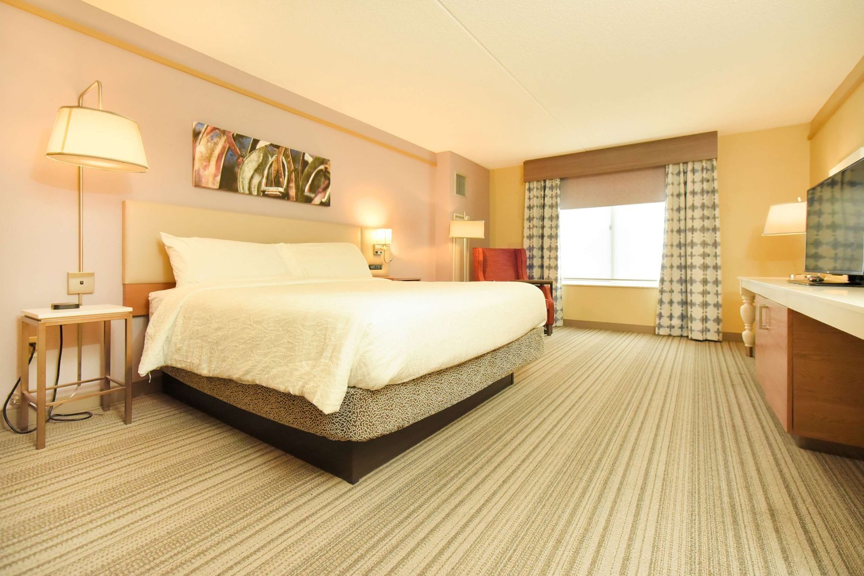 Premium bedding, desk, laptop workspace, blackout curtains