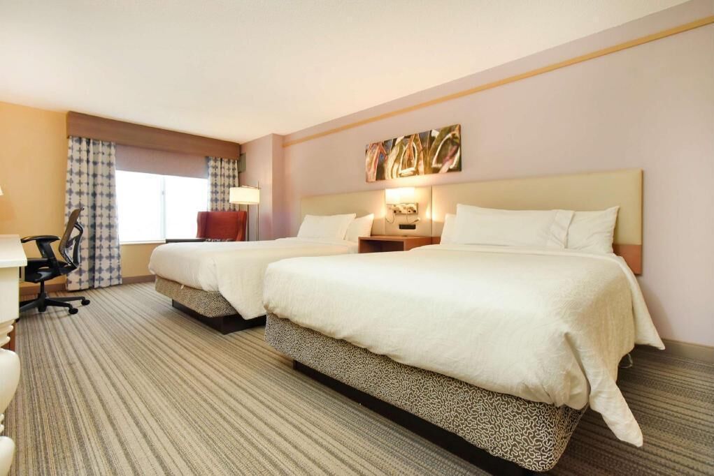 Premium bedding, desk, laptop workspace, blackout curtains