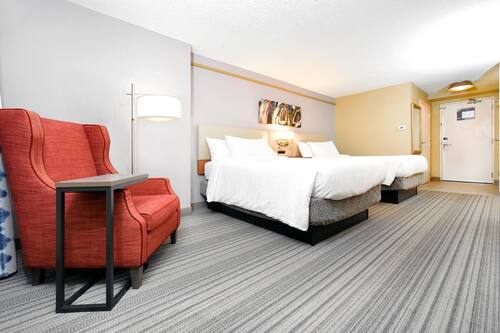 Premium bedding, desk, laptop workspace, blackout drapes