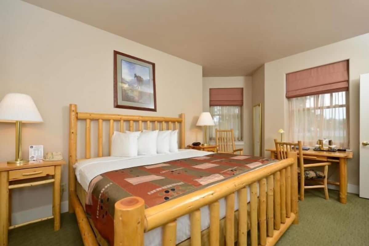 Desk, laptop workspace, blackout drapes, iron/ironing board