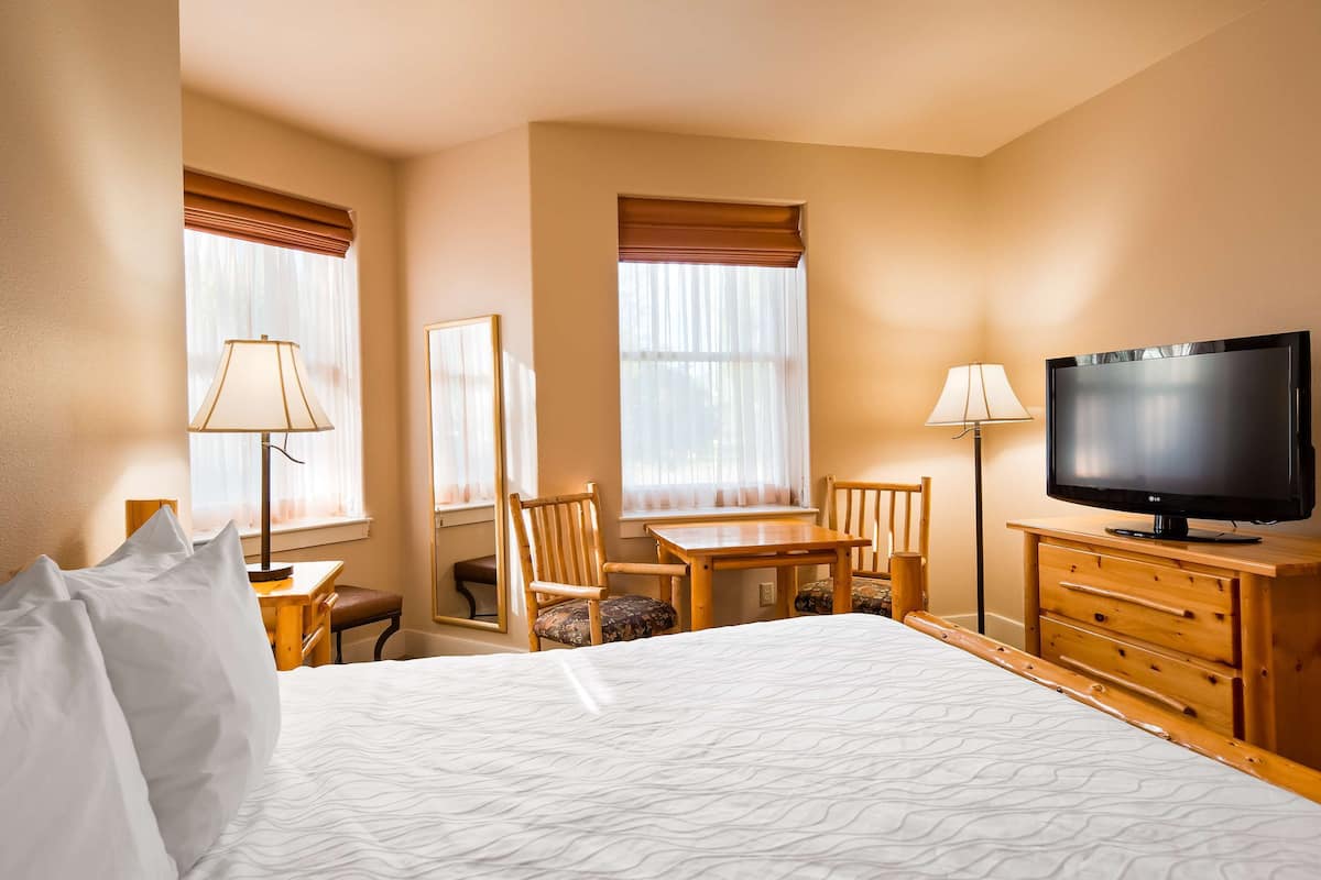 desk, laptop workspace, blackout curtains, iron/ironing board