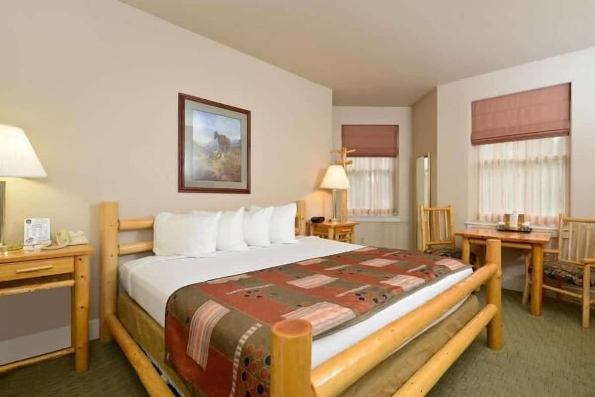 Desk, laptop workspace, blackout drapes, iron/ironing board