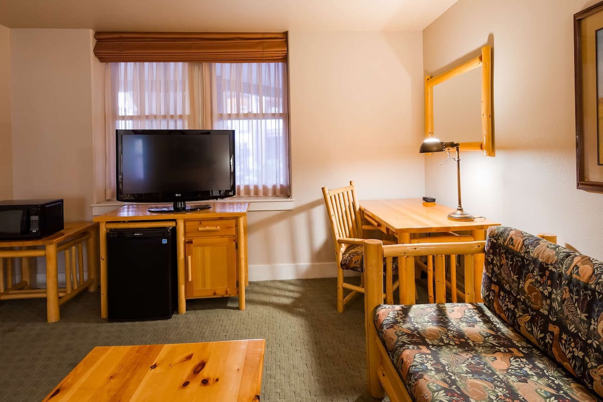 desk, laptop workspace, blackout curtains, iron/ironing board