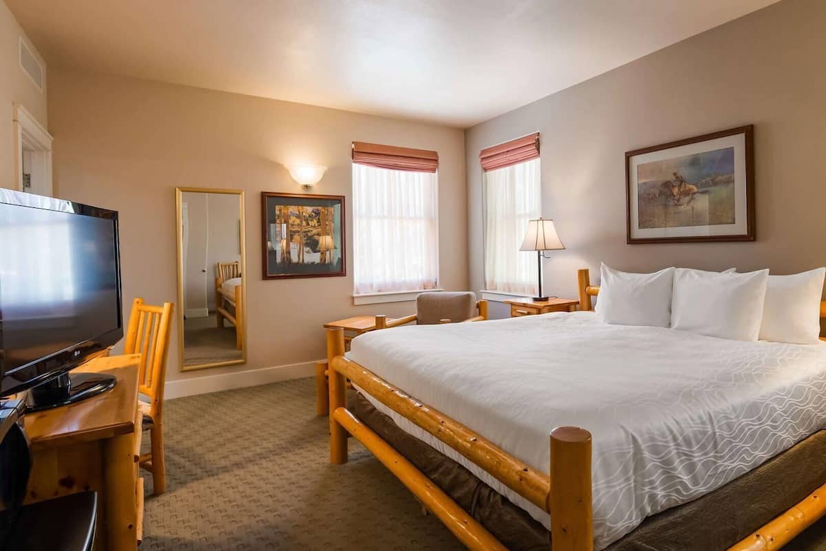 Desk, laptop workspace, blackout drapes, iron/ironing board