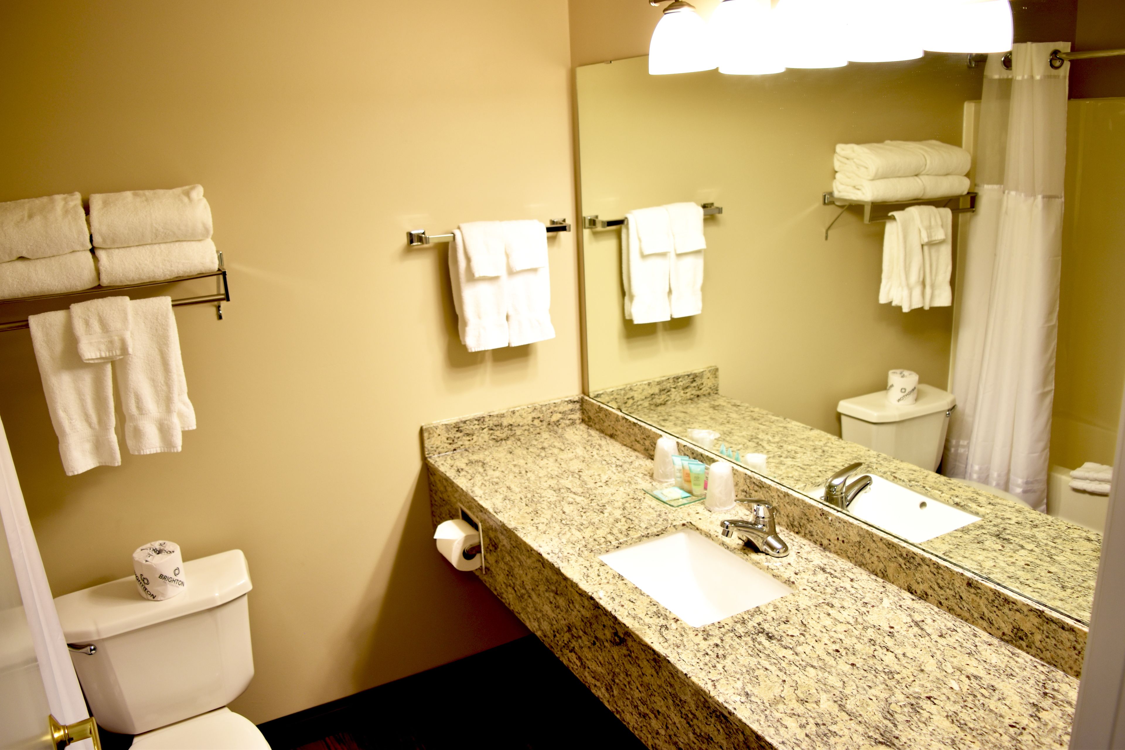 designer toiletries, hair dryer, towels