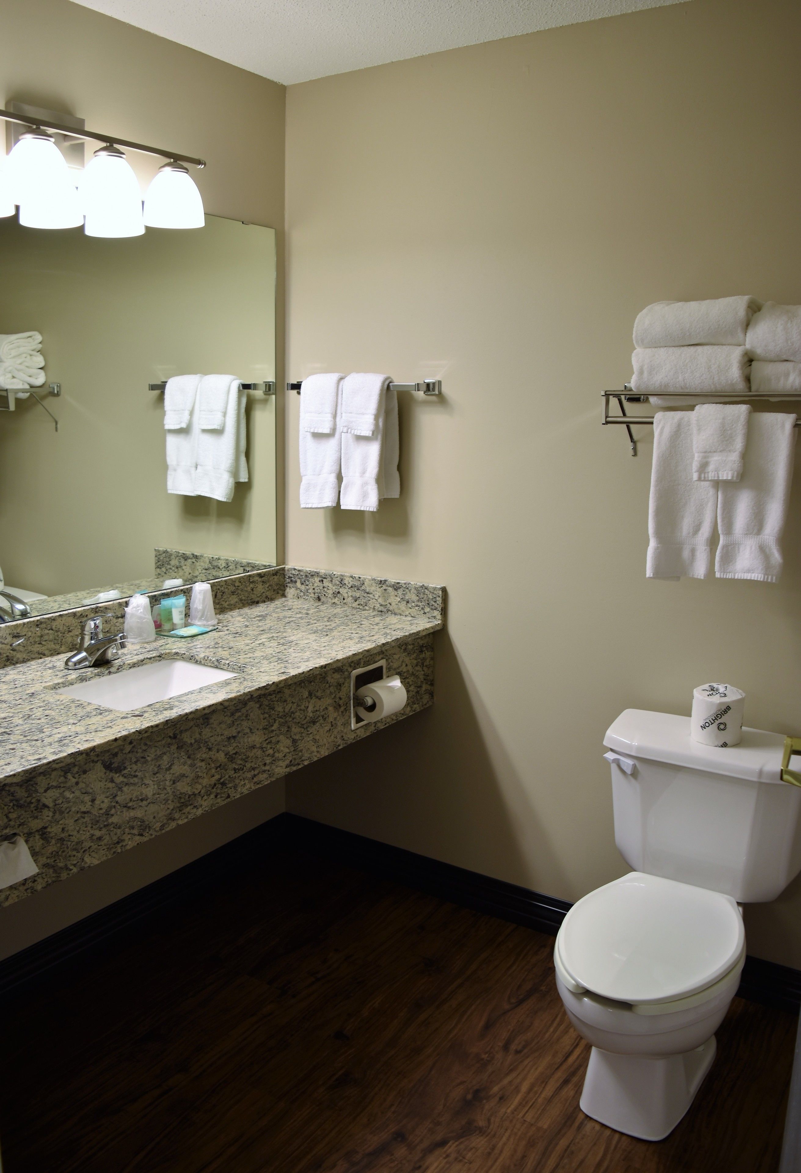 designer toiletries, hair dryer, towels