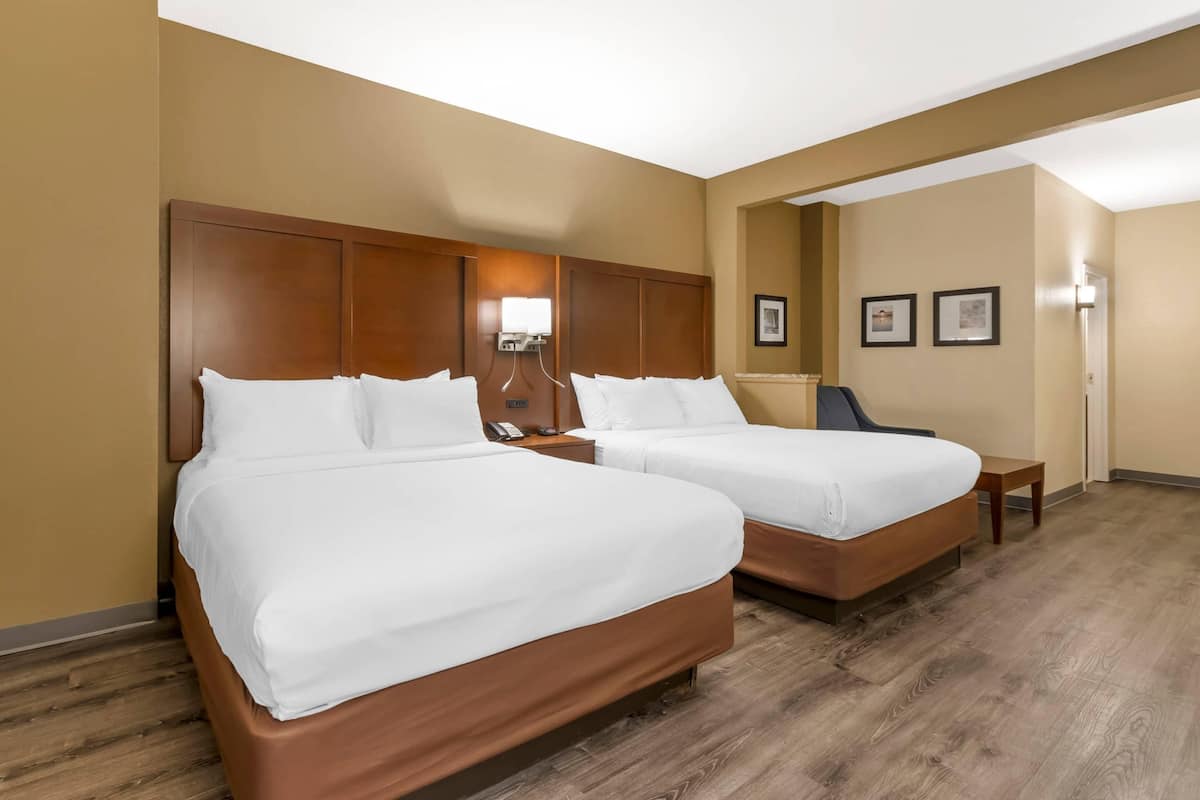 Suite, 2 Queen Beds, Non Smoking | Desk, laptop workspace, blackout curtains, iron/ironing board