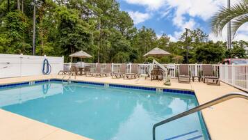Seasonal outdoor pool, open 8 AM to 10 PM, pool umbrellas, pool loungers