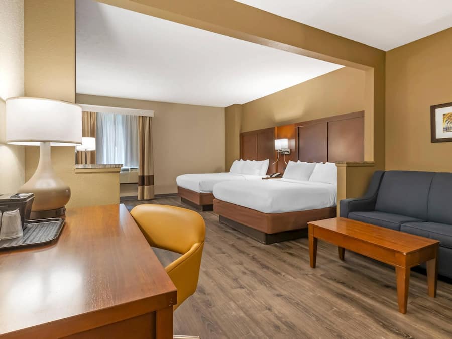 Suite, 2 Queen Beds, Non Smoking | Desk, laptop workspace, blackout curtains, iron/ironing board