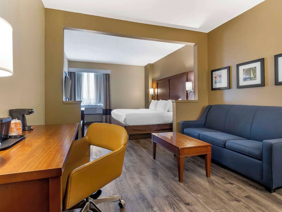 Desk, laptop workspace, blackout drapes, iron/ironing board