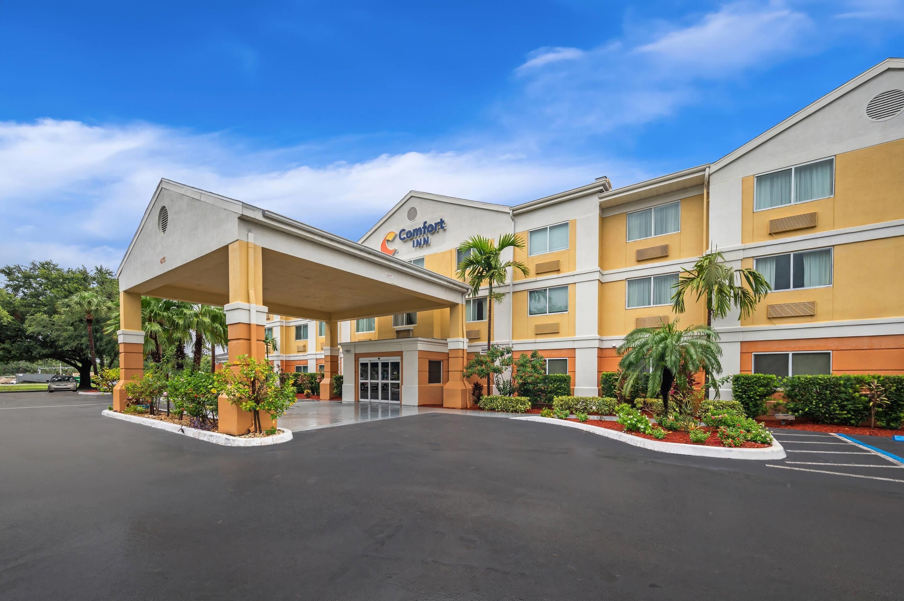 A Comfort Inn hotel with a covered entrance, multiple floors, and a parking lot.
