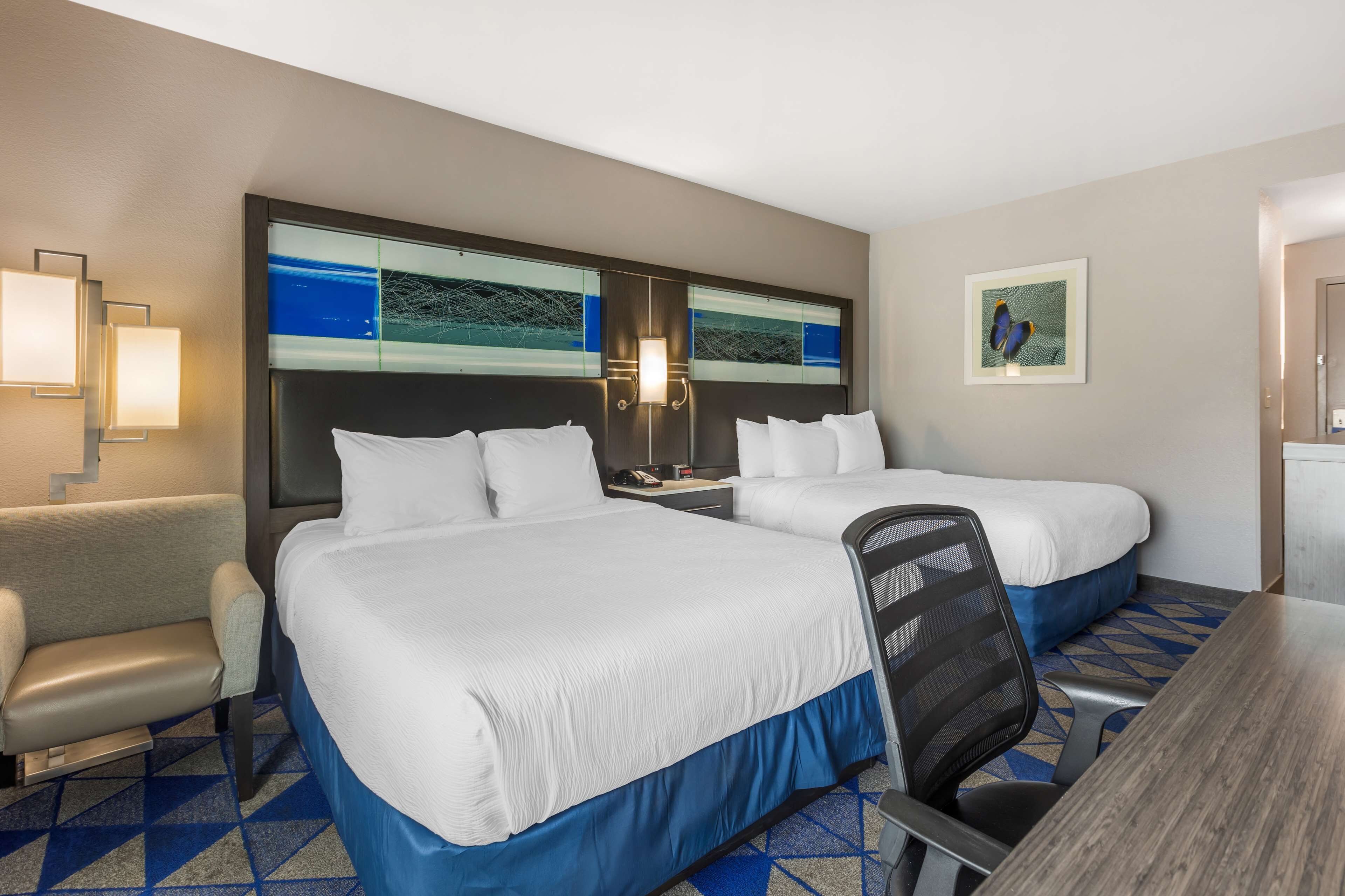 standard room, 2 queen beds, non smoking, microwave | 1 bedroom, desk, laptop workspace, blackout curtains