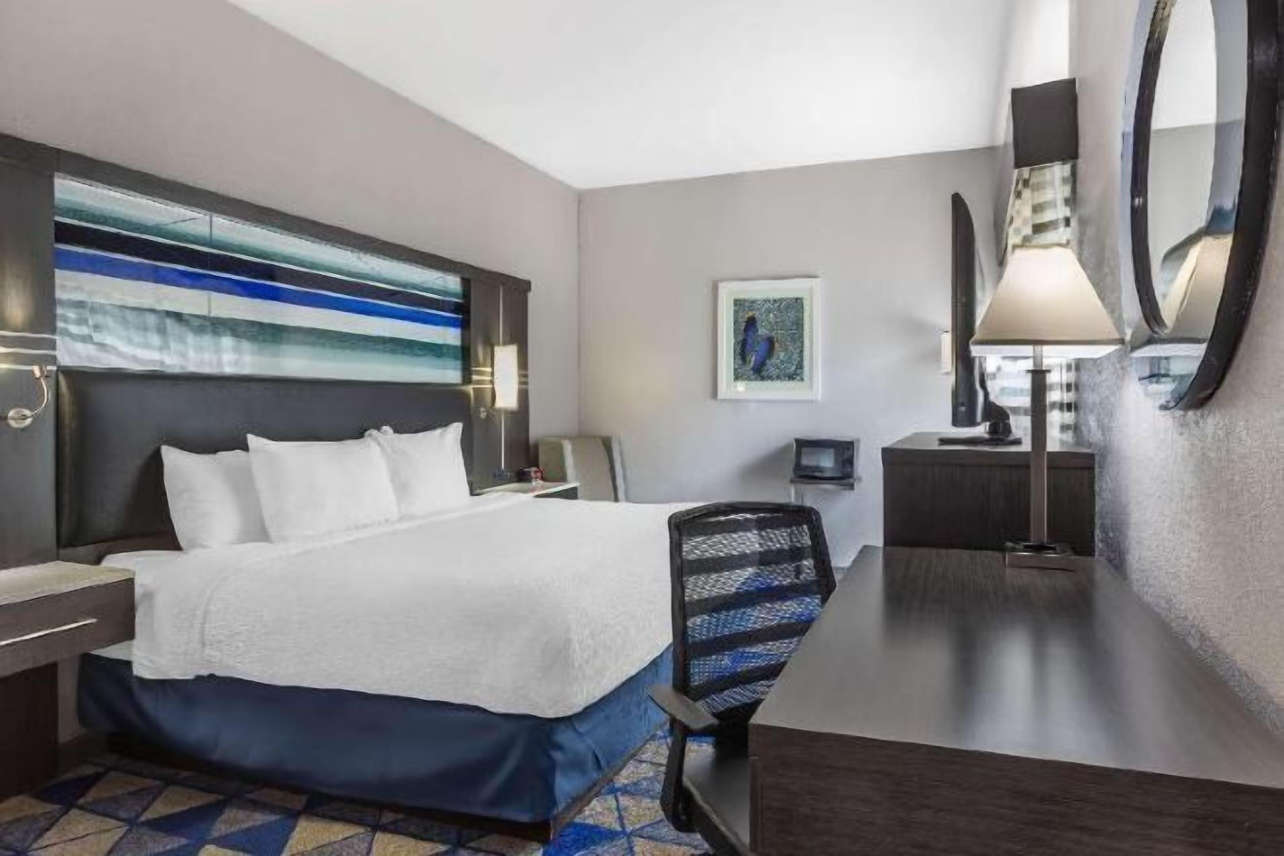 Desk, laptop workspace, blackout curtains, iron/ironing board