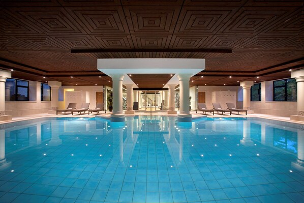 Indoor pool, open 7:00 AM to 10:00 PM, pool loungers