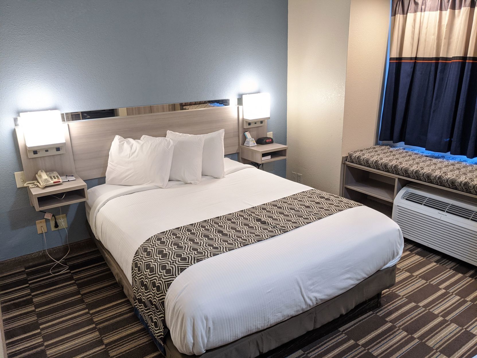 Hypo-allergenic bedding, pillowtop beds, desk, laptop workspace