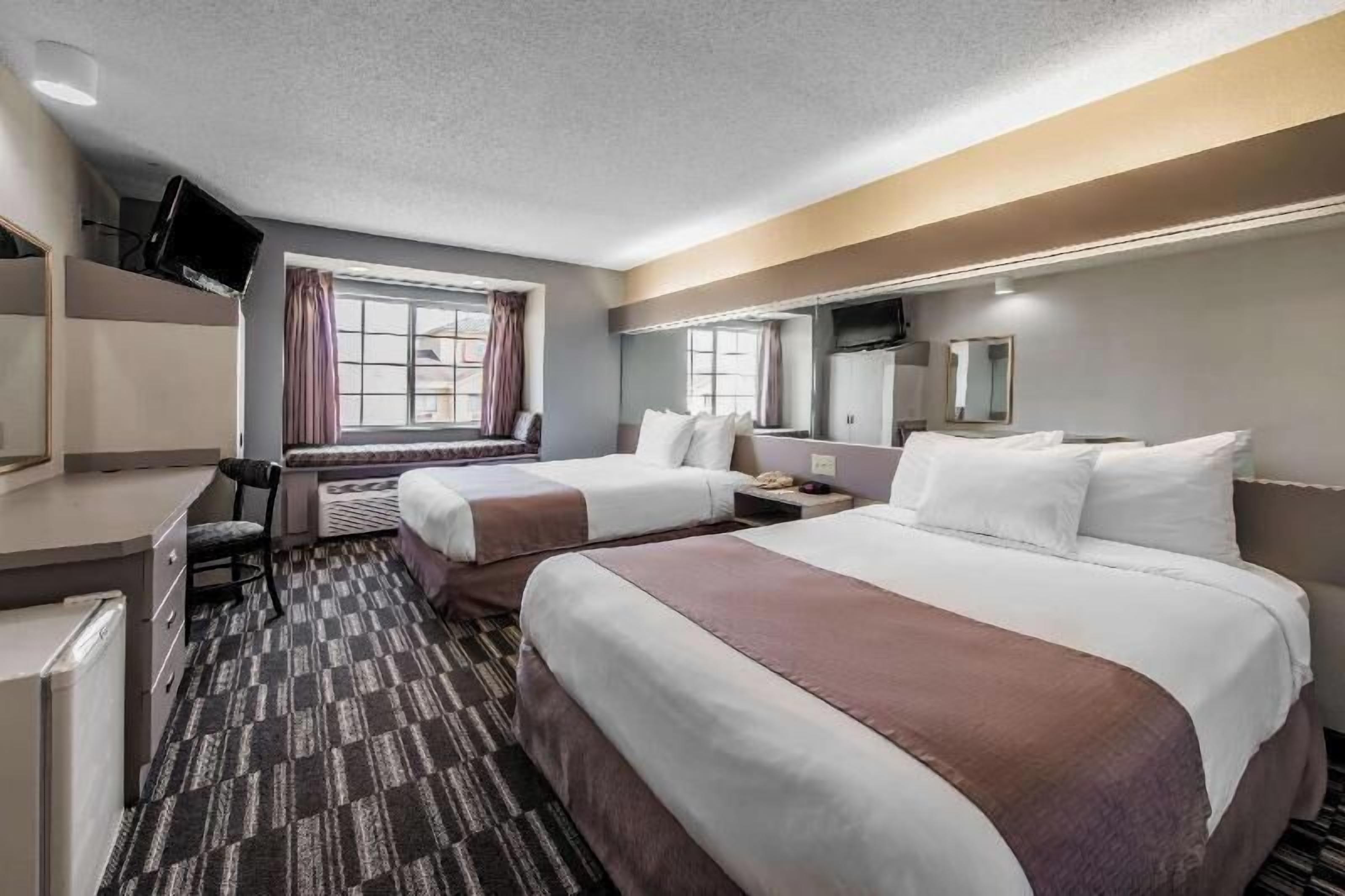 Hypo-allergenic bedding, pillowtop beds, desk, laptop workspace