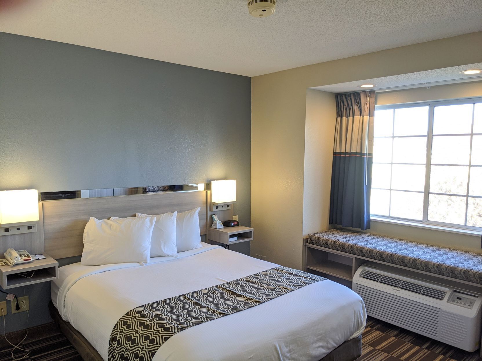 Hypo-allergenic bedding, pillowtop beds, desk, laptop workspace