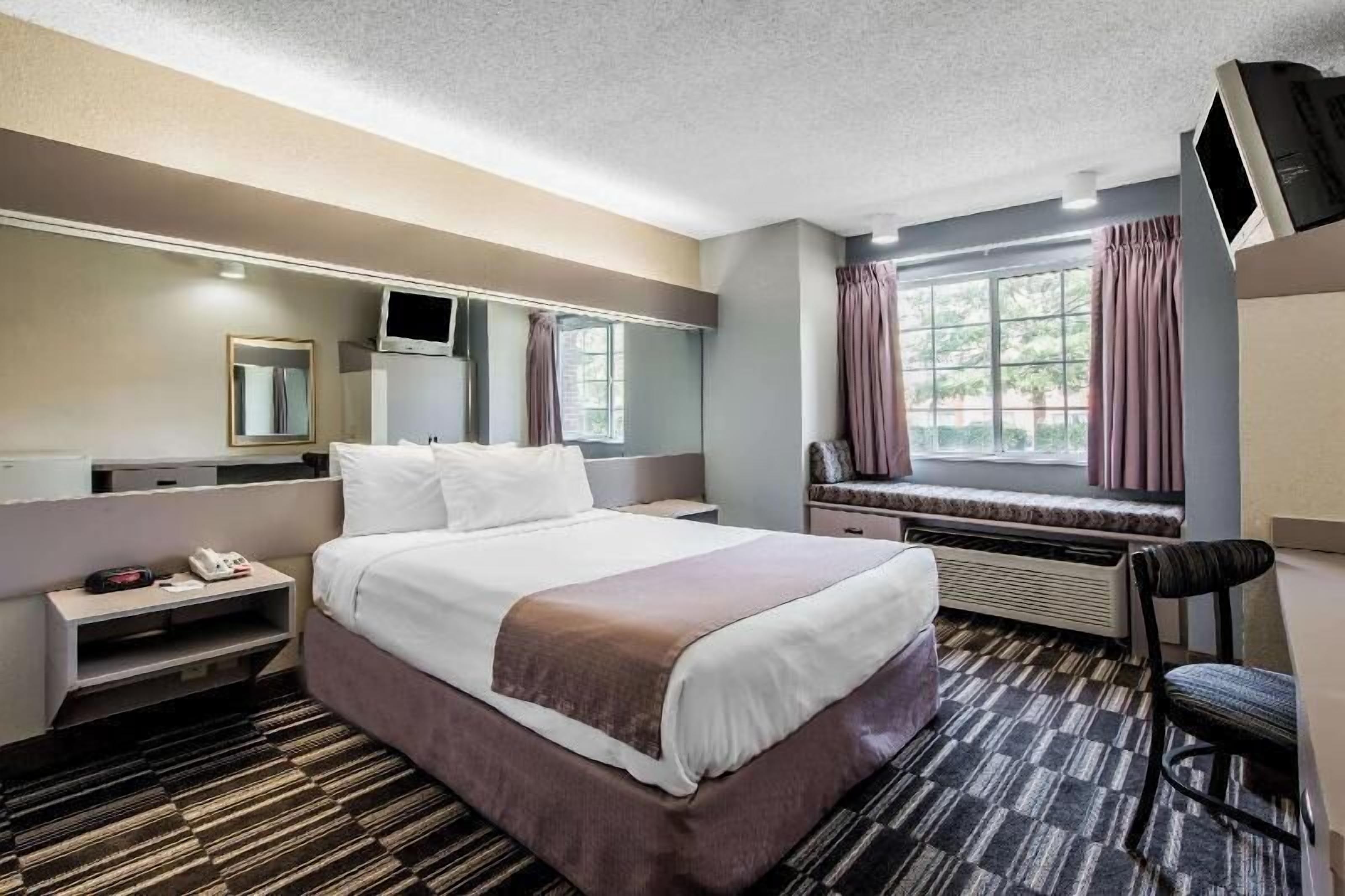 Hypo-allergenic bedding, pillowtop beds, desk, laptop workspace