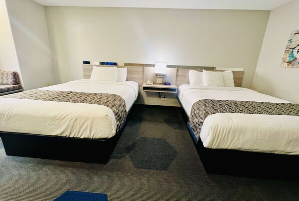 Hypo-allergenic bedding, pillowtop beds, desk, laptop workspace