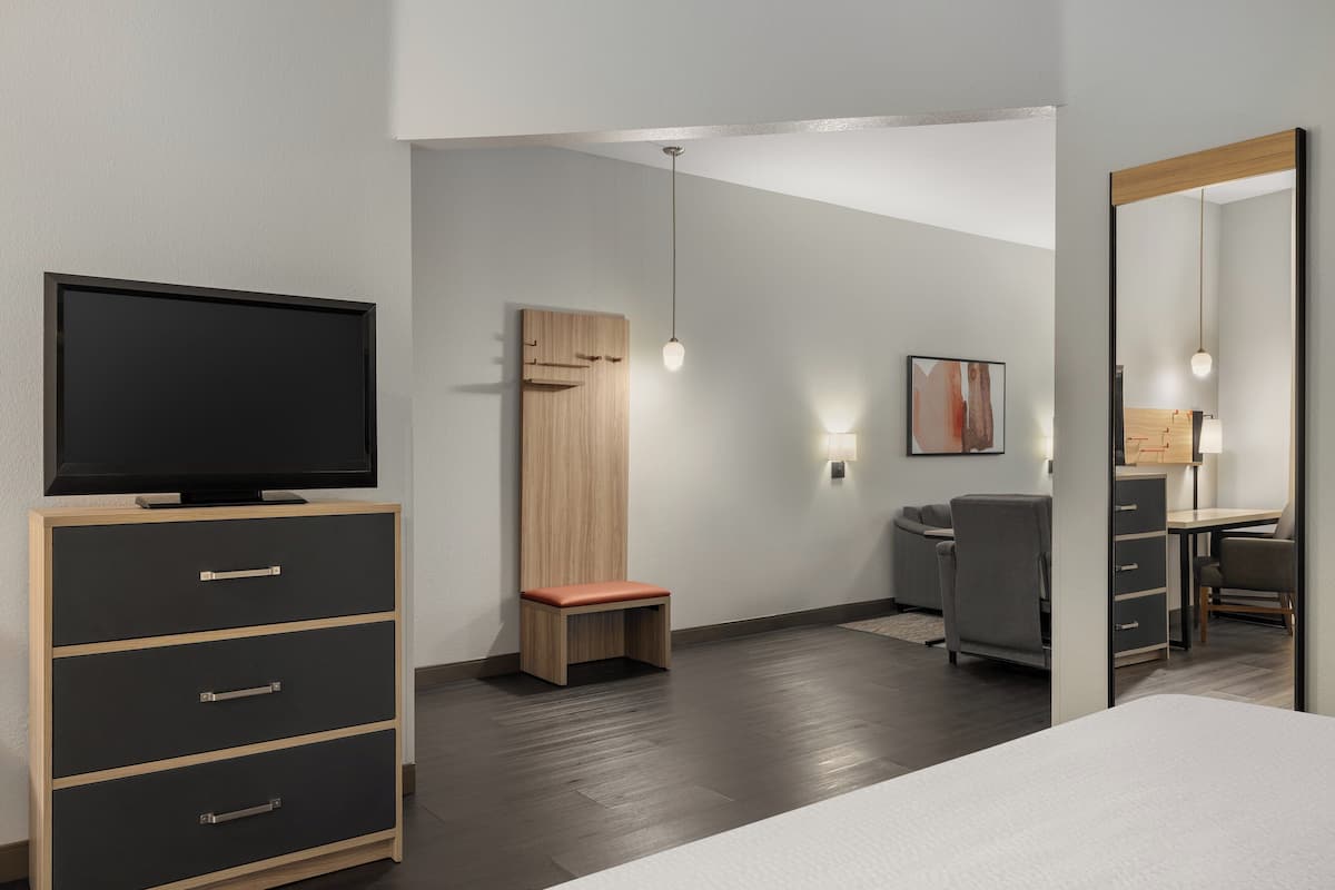 Suite, 1 Bedroom w/ Queen Bed | Desk, laptop workspace, blackout drapes, iron/ironing board