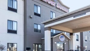 A hotel named 'Comfort Suites' with a modern facade, multiple windows, and a clear entrance. - Comfort Suites Fort Wayne North (Fort Wayne)