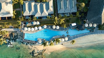 Outdoor pool, open 9:00 AM to 7:00 PM, pool umbrellas, pool loungers