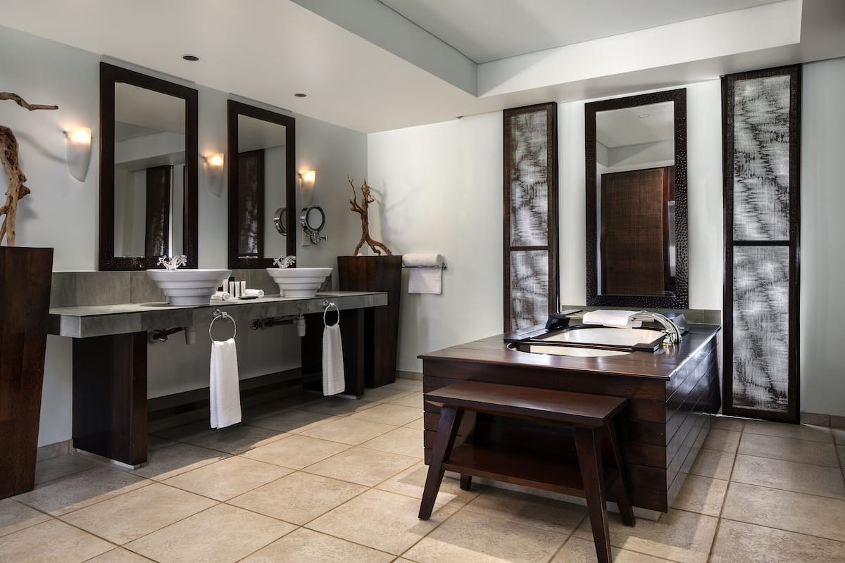 deluxe suite, oceanfront | bathroom | rainfall showerhead, free toiletries, hair dryer, bathrobes