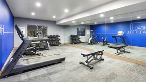 A modern gym with treadmills, dumbbells, and exercise equipment. - Holiday Inn Express Redding North by IHG (Redding)