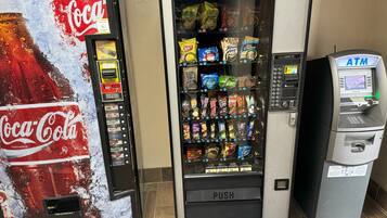 A Coca-Cola vending machine and an ATM.