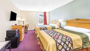 A hotel room with two beds, a desk with a computer, a TV, and a window with a view. - Super 8 by Wyndham Manning (Manning)