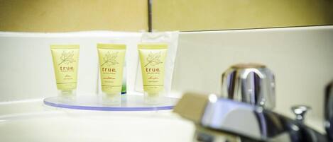 Three tubes of 'true' shampoo on a bathroom sink.